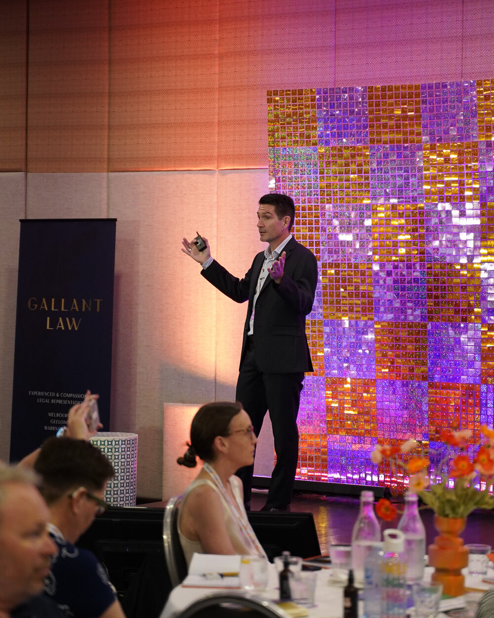 Matthew Clarkson presenting on AI to a conference audience at the Happy Lawyer Happy Life conference